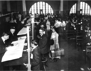 Vintage black and white photo of people researching documents.